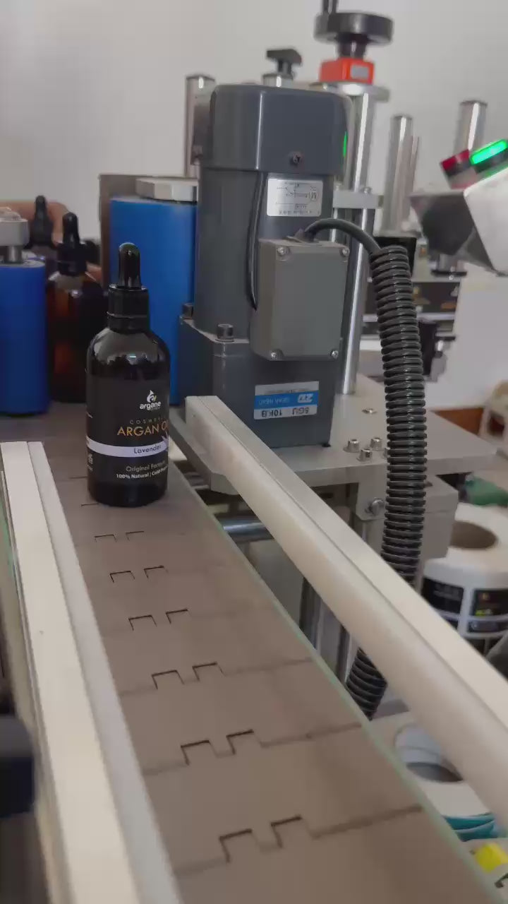 Automated production line at the Zineglob factory for packaging cosmetic products and organic argan oil.